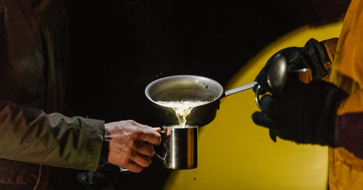 Free camping in Uk, Belgium, Netherlands - is it legal? - A Person Pouring Food in Silver Cup Free camping in Uk, Belgium, Netherlands - is it legal? - A Person Pouring Food in Silver Cup