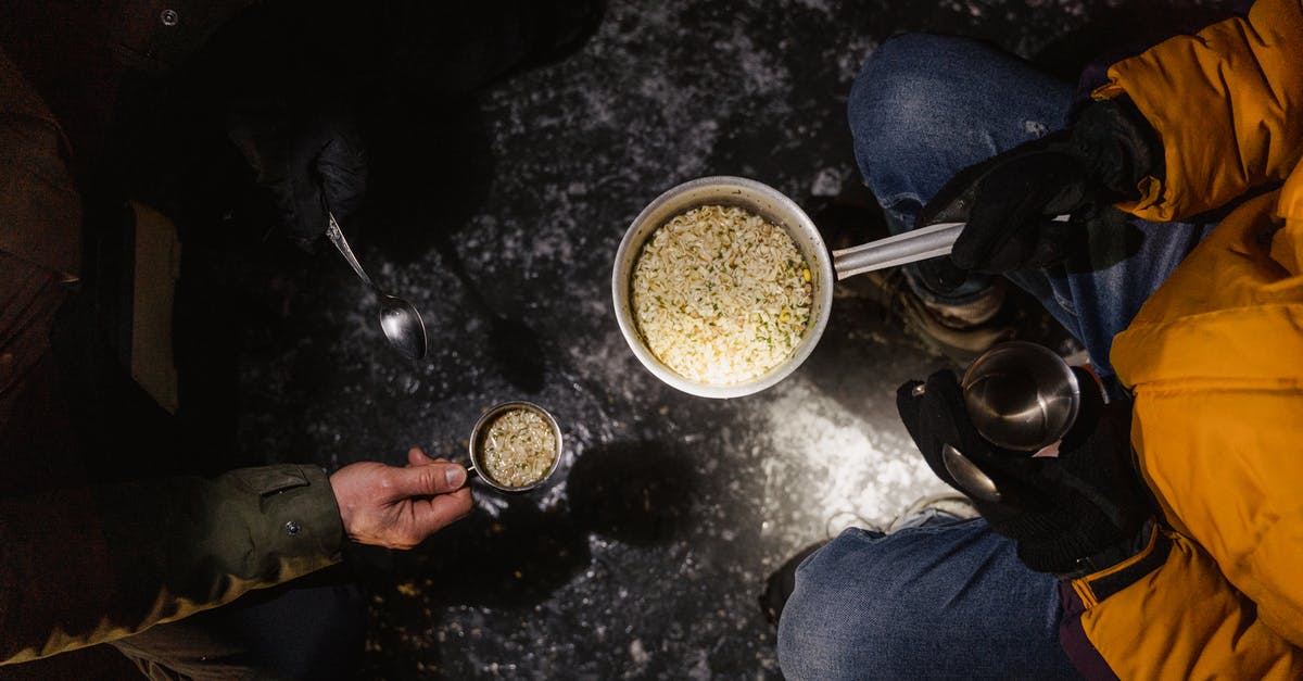 Free camping in Uk, Belgium, Netherlands - is it legal? - A Person Holding Cooking Pot with Food Free camping in Uk, Belgium, Netherlands - is it legal? - A Person Holding Cooking Pot with Food
