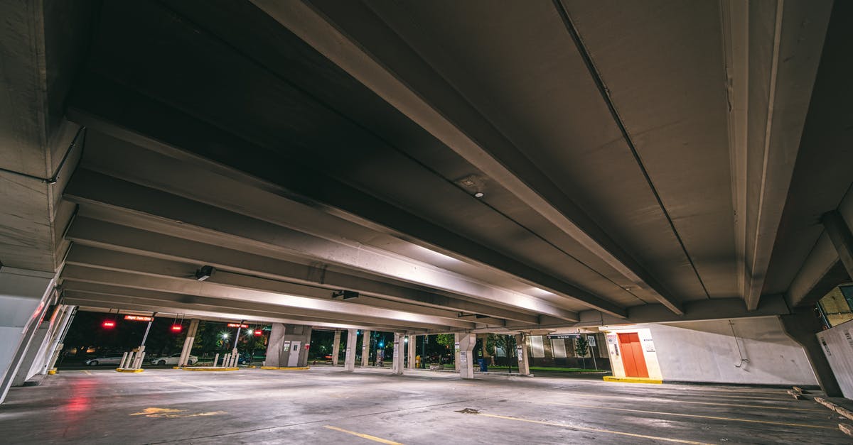 Free street parking options for unlimited time in Bratislava? - Entrance to underground parking with empty spaces under concrete roof at night time Free street parking options for unlimited time in Bratislava? - Entrance to underground parking with empty spaces under concrete roof at night time