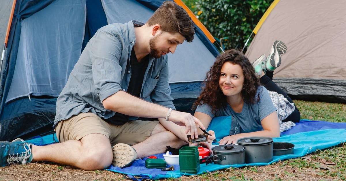 Free tent camping location close to Adelaide? - Positive young couple using portable camping gas stove while resting of plaid near tent during romantic trip in nature Free tent camping location close to Adelaide? - Positive young couple using portable camping gas stove while resting of plaid near tent during romantic trip in nature