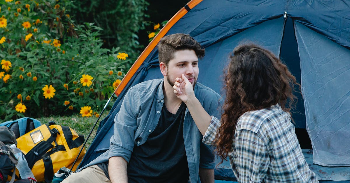 Free tent camping location close to Adelaide? - Young woman touching face of boyfriend during romantic picnic in nature Free tent camping location close to Adelaide? - Young woman touching face of boyfriend during romantic picnic in nature