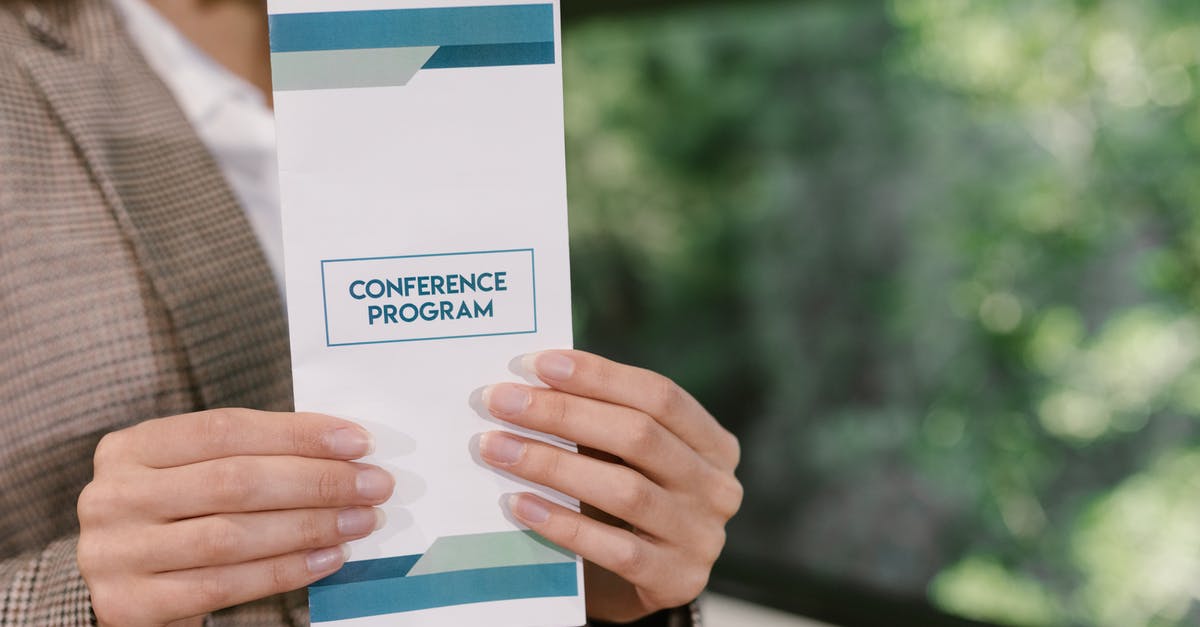 Frequent Flyer (Downgrading) - A Person Holding a Paper with Printed Texts Frequent Flyer (Downgrading) - A Person Holding a Paper with Printed Texts