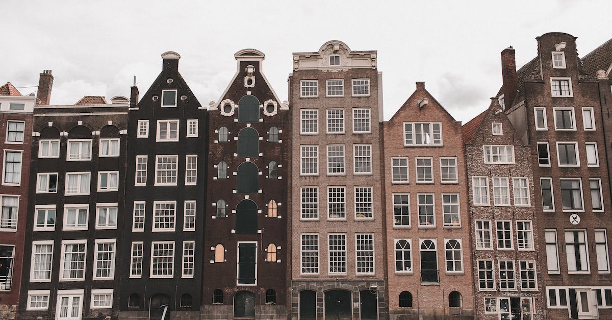 From Amsterdam (Netherlands) to Lima (Peru) by flight? - Brown and White Concrete Building Near Body of Water From Amsterdam (Netherlands) to Lima (Peru) by flight? - Brown and White Concrete Building Near Body of Water