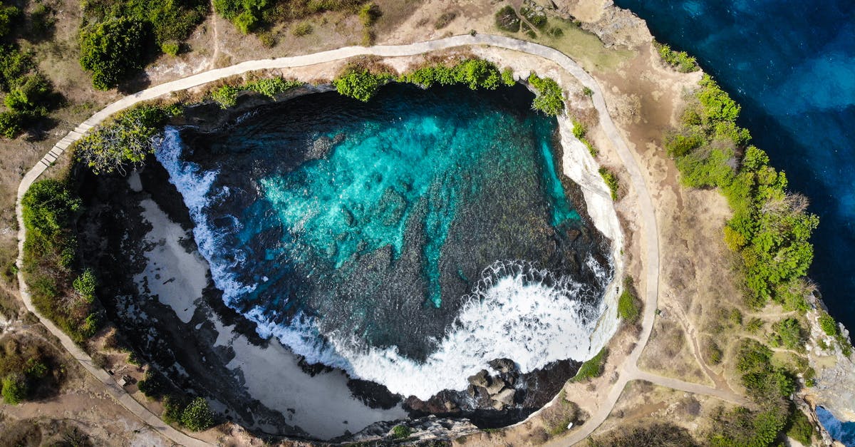 From Bali to Jakarta by bus and ferry how to? - Aerial PhotO of Hole Near Sea With Clear Body Of Water From Bali to Jakarta by bus and ferry how to? - Aerial PhotO of Hole Near Sea With Clear Body Of Water