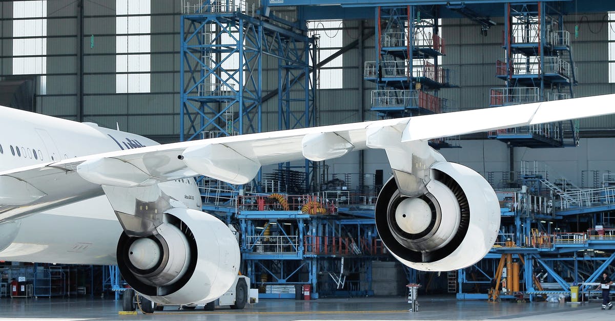 From Milano Autostazione Lampugnano to Bergamo airport - Low angle of engines and wing of modern aircraft in docking station on sunny day From Milano Autostazione Lampugnano to Bergamo airport - Low angle of engines and wing of modern aircraft in docking station on sunny day