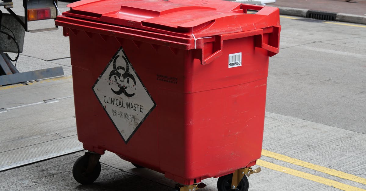 Garbage bin on Khao San Road, Bangkok - A Red Plastic Garbage Bin for Clinical Waste Garbage bin on Khao San Road, Bangkok - A Red Plastic Garbage Bin for Clinical Waste