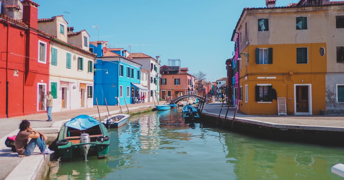General Visit visa enquire for Italy - Boat on River Near Buildings General Visit visa enquire for Italy - Boat on River Near Buildings