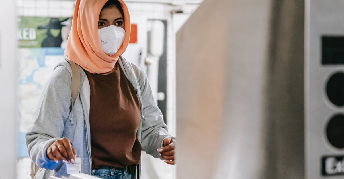 German SIM card for a two-week visit? - Muslim female in mask going through turnstile German SIM card for a two-week visit? - Muslim female in mask going through turnstile