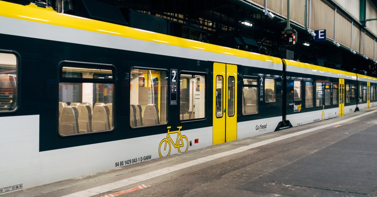 Germany to Italy by train or car in 2017, now the Gotthard tunnel is open? - White and Yellow Train on Train Station Germany to Italy by train or car in 2017, now the Gotthard tunnel is open? - White and Yellow Train on Train Station