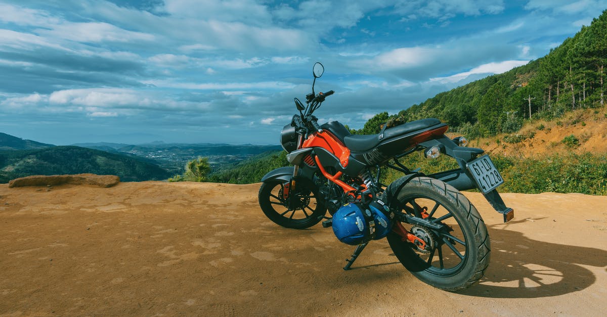 Getting a motorcycle license in France - Photography of Orange and Black Sports Motorcycle Near a Cliff Getting a motorcycle license in France - Photography of Orange and Black Sports Motorcycle Near a Cliff