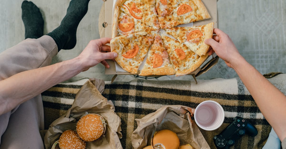 Getting a SIM card (prepay) in India - Person Holding Pizza on White Ceramic Plate Getting a SIM card (prepay) in India - Person Holding Pizza on White Ceramic Plate