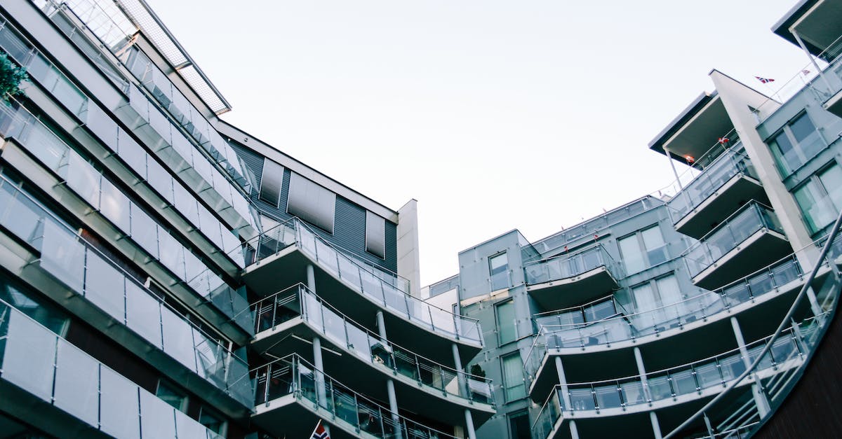 Getting from Düsseldorf airport to the city centre - Modern geometric glass building with balconies Getting from Düsseldorf airport to the city centre - Modern geometric glass building with balconies