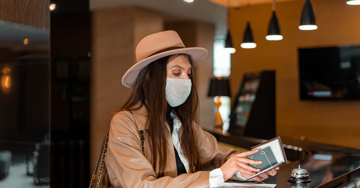 Getting hold of tourist SIM card in Shenzhen, China - A Woman Holding a Card Getting hold of tourist SIM card in Shenzhen, China - A Woman Holding a Card
