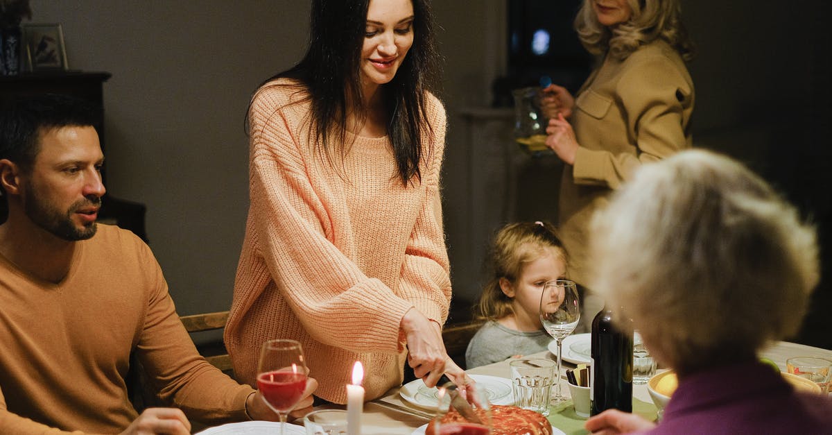 Getting to Laulupidu – Estonia - A Woman Slicing a Pie at a Dining Table Getting to Laulupidu – Estonia - A Woman Slicing a Pie at a Dining Table