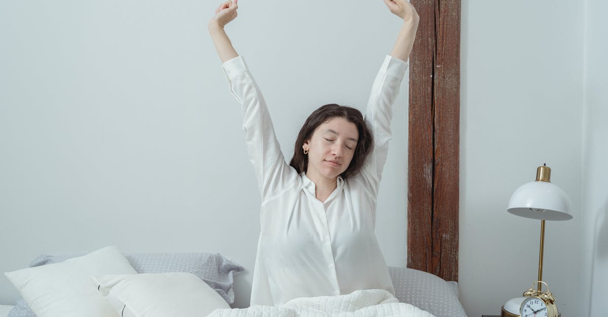 Getting to Sabiha Gokcen (SAW) airport early in the morning across Bosphorus [closed] - Sleepy woman waking up on bed in morning