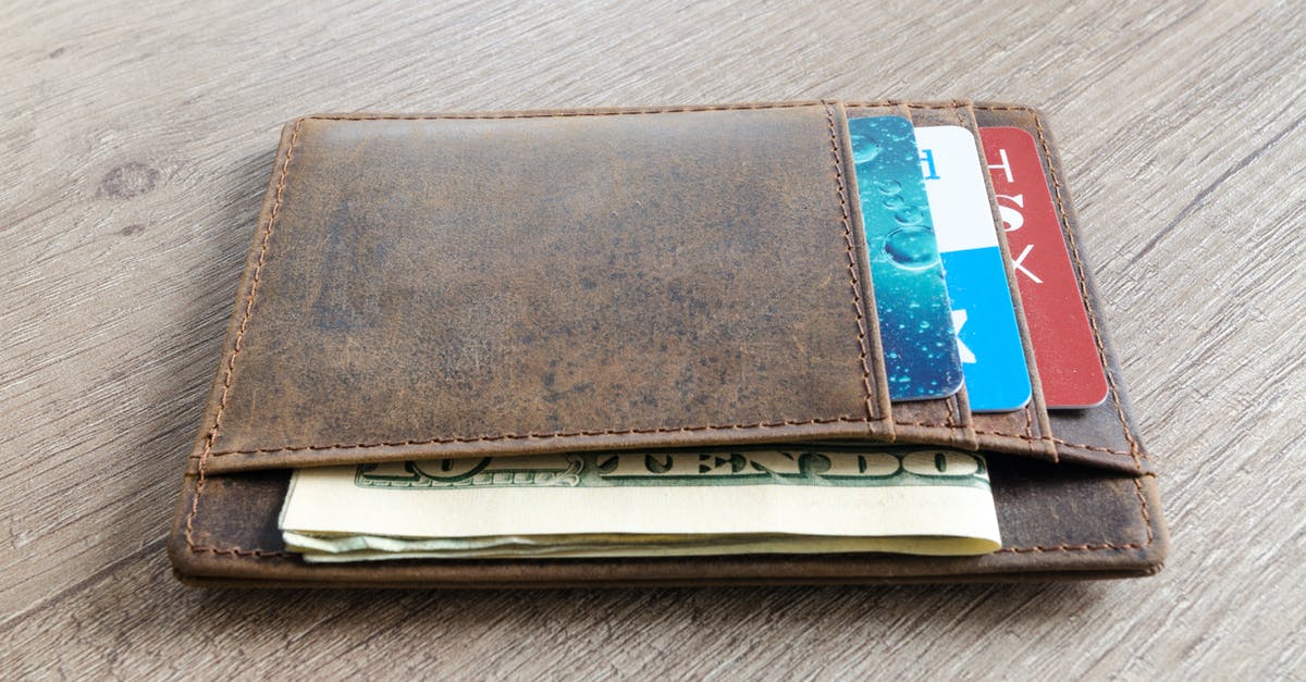 Getting USD cash in Munich on UK cards - Brown Leather Wallet and Us Dollar Banknote Getting USD cash in Munich on UK cards - Brown Leather Wallet and Us Dollar Banknote
