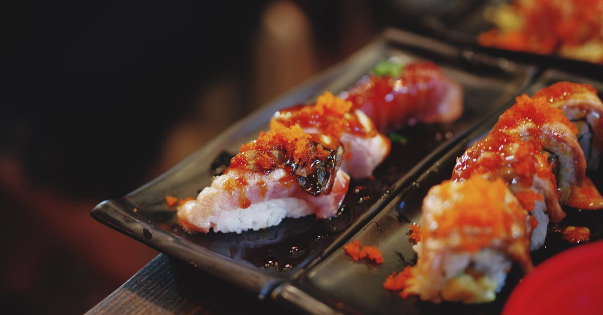 Gift-giving rules for Japanese dinner host - California Maki on Black Plate Gift-giving rules for Japanese dinner host - California Maki on Black Plate