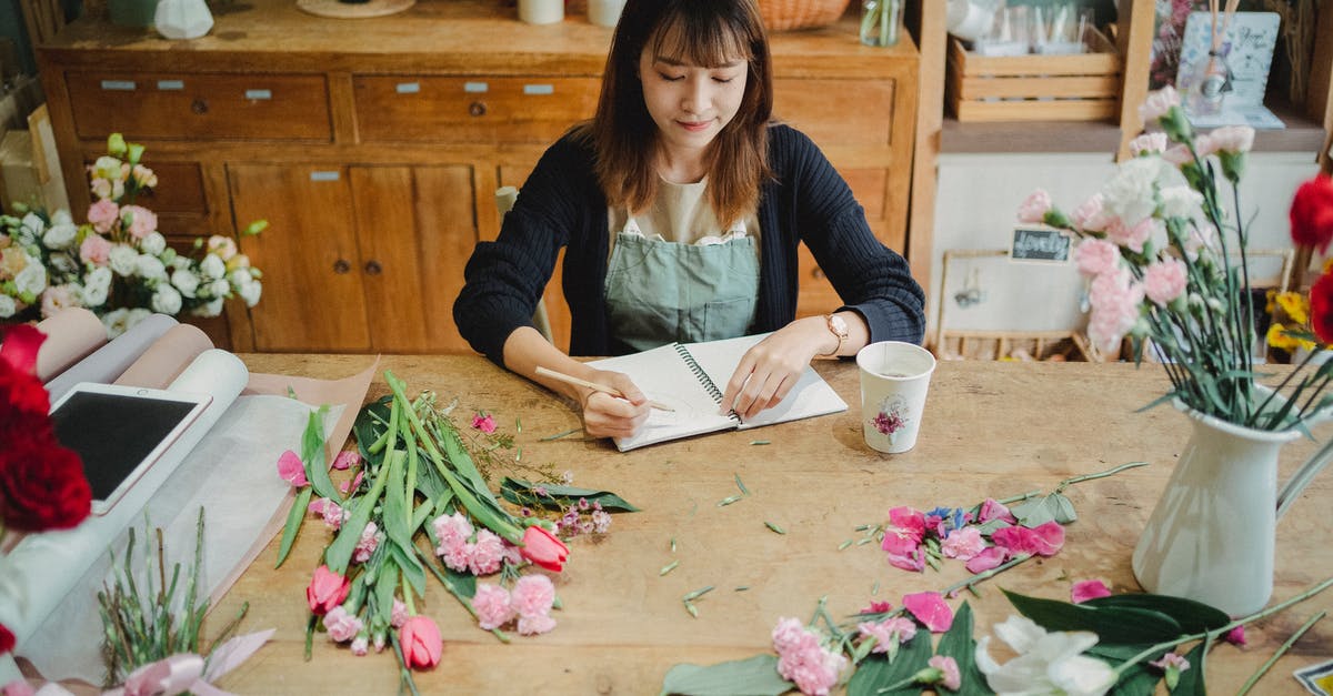 Going from Sweden to the US with a London layover, can I take a bouquet of roses? - Asian florist taking notes in notebook Going from Sweden to the US with a London layover, can I take a bouquet of roses? - Asian florist taking notes in notebook