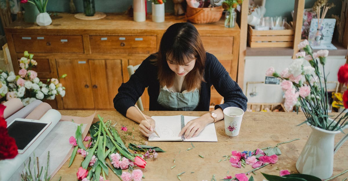 Going from Sweden to the US with a London layover, can I take a bouquet of roses? - Concentrated Asian woman creating floral design Going from Sweden to the US with a London layover, can I take a bouquet of roses? - Concentrated Asian woman creating floral design