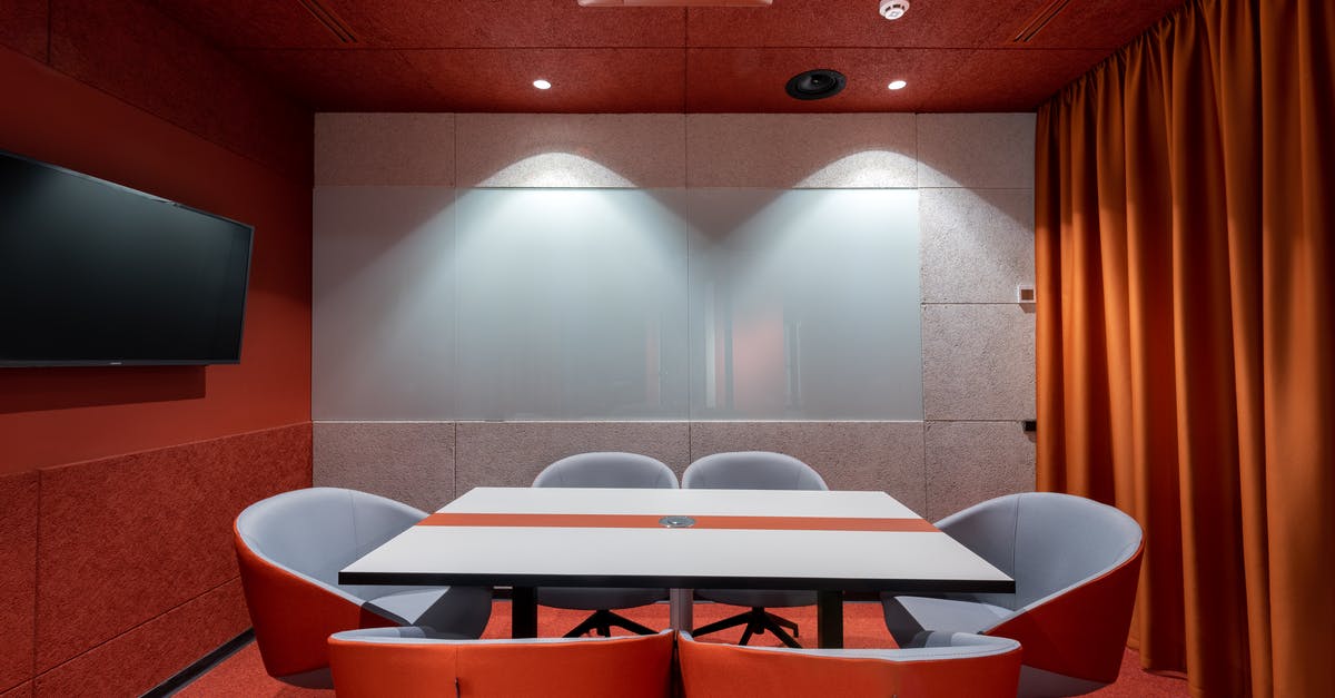 Going to New Delhi for a conference. Where to drink/get water? - Comfortable red chairs placed around white table in modern conference room with TV and curtains in contemporary office of business center Going to New Delhi for a conference. Where to drink/get water? - Comfortable red chairs placed around white table in modern conference room with TV and curtains in contemporary office of business center
