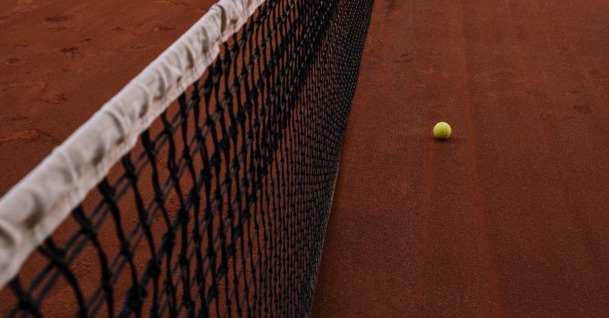 Going to the Wimbledon tennis championships while in London - Tennis Ball on Tennis Court Going to the Wimbledon tennis championships while in London - Tennis Ball on Tennis Court