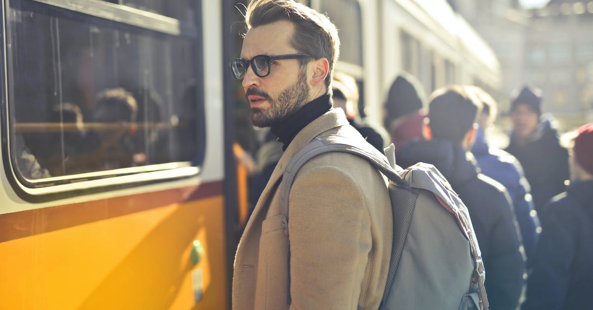 Good website for checking train options in Spain/Portugal? - Man in Brown Coat and Gray Backpack Posing for a Photo Good website for checking train options in Spain/Portugal? - Man in Brown Coat and Gray Backpack Posing for a Photo