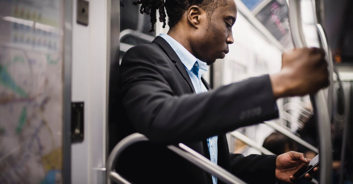 Google Maps public transport in offline mode? - Side view of crop wistful African American passenger with pigtails in formal wear using social media on cellphone while commuting to work on subway Google Maps public transport in offline mode? - Side view of crop wistful African American passenger with pigtails in formal wear using social media on cellphone while commuting to work on subway