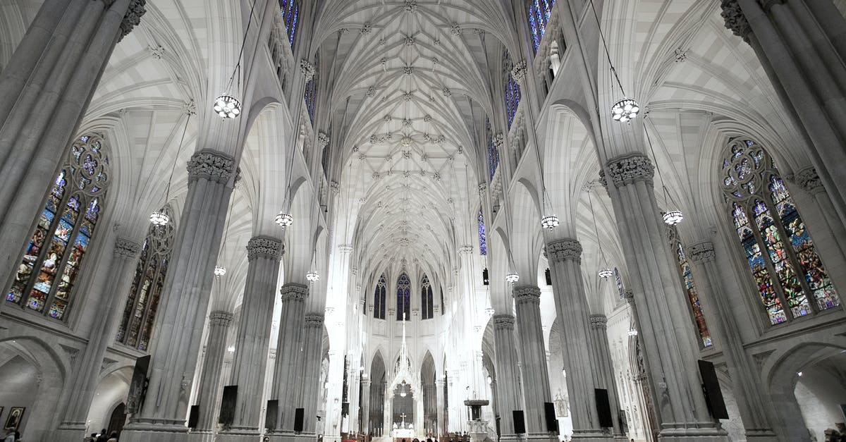 Gospel church in New York City - Interior of neo Gothic cathedral with colonnade and arched windows Gospel church in New York City - Interior of neo Gothic cathedral with colonnade and arched windows