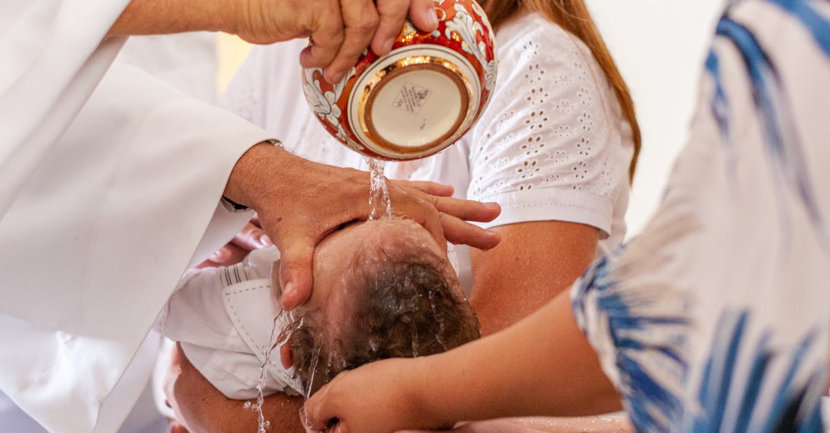 Granted admission on WB instead of B1/B2, Denied Correction by CBP - Crop anonymous priest pouring water on little baby head lying on parents hands during baptism ceremony in Catholic church Granted admission on WB instead of B1/B2, Denied Correction by CBP - Crop anonymous priest pouring water on little baby head lying on parents hands during baptism ceremony in Catholic church