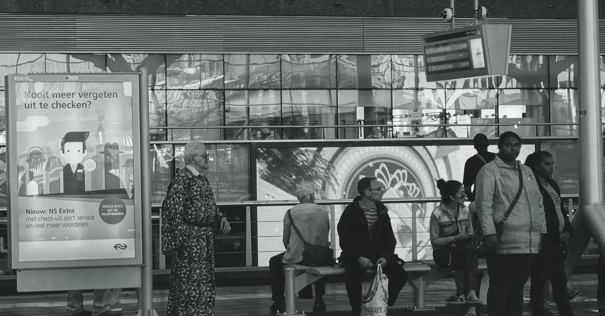 Group travel in the train in the Netherlands, how does it work? - Grayscale People on Terminal Group travel in the train in the Netherlands, how does it work? - Grayscale People on Terminal
