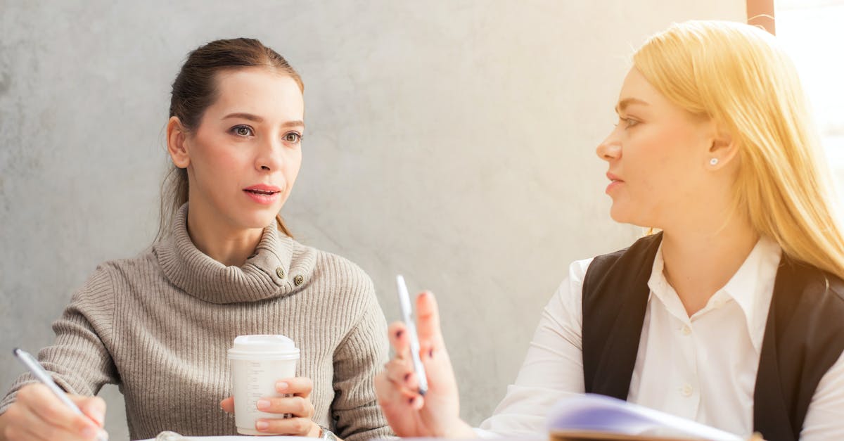 Group visa applied but not received for one member - Two Women Holding Pen Group visa applied but not received for one member - Two Women Holding Pen