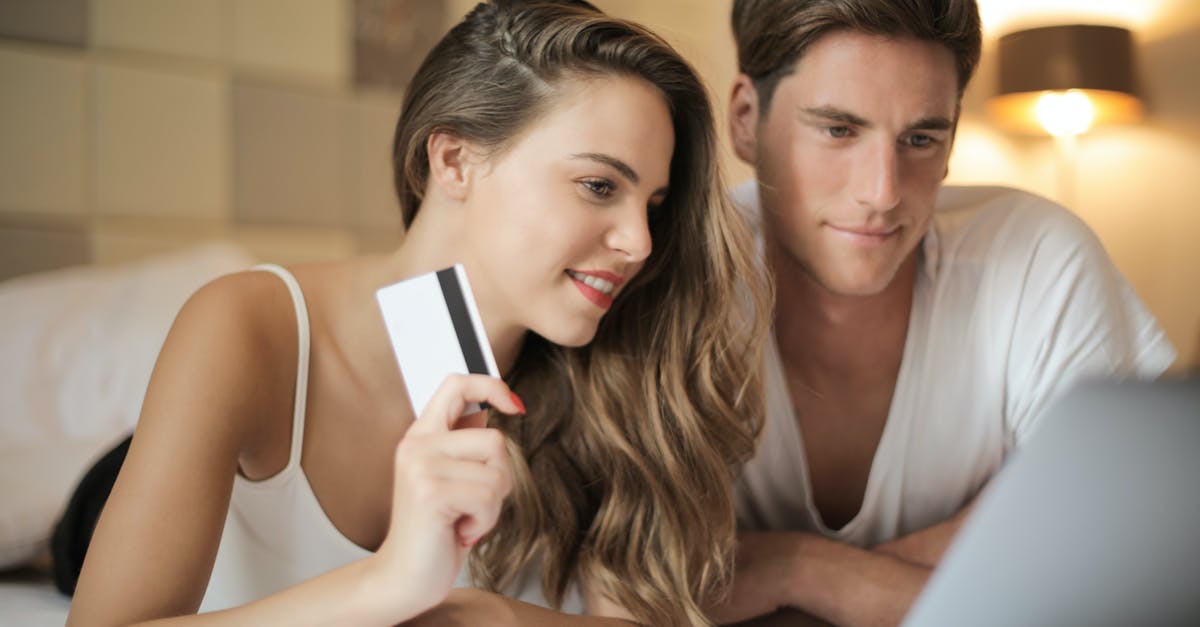 Have anyone used Alipay to pay for their Airbnb? - Cheerful couple making online purchases at home Have anyone used Alipay to pay for their Airbnb? - Cheerful couple making online purchases at home