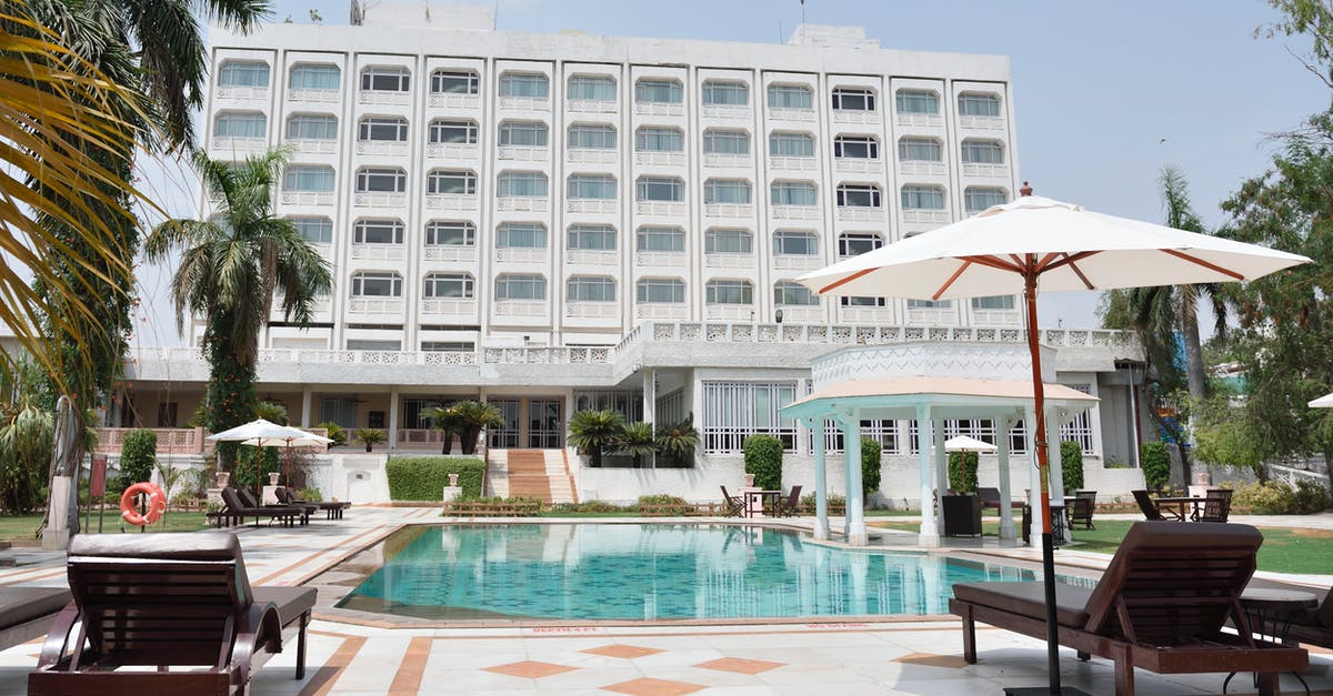 Have hotels been re-established in Kedarnath, India after the floods? - Gray Concrete Swimming Pool Beside White Building