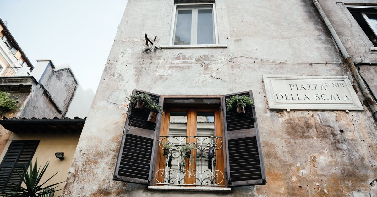 Hiring a Ferrari in Italy - Brown Wooden Window on White Concrete Building Hiring a Ferrari in Italy - Brown Wooden Window on White Concrete Building