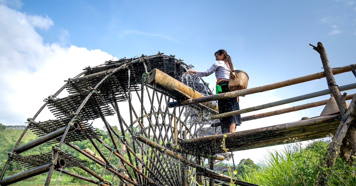 Historic Boston Sites - Good Resource - Woman standing near old water wheel Historic Boston Sites - Good Resource - Woman standing near old water wheel