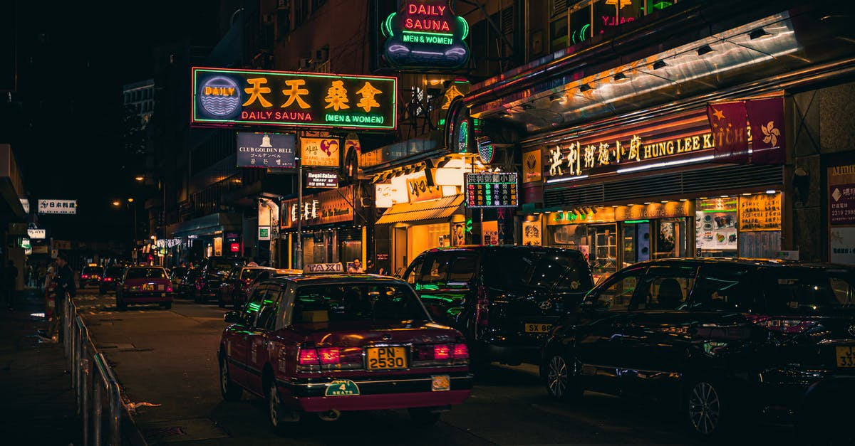 Hong Kong street photography? - Cars Beside Neon Signages Hong Kong street photography? - Cars Beside Neon Signages