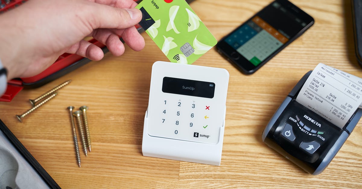 Hotel Price Check Guarantee - Heyitscheaper.com? [closed] - Unrecognizable person providing plastic card for payment