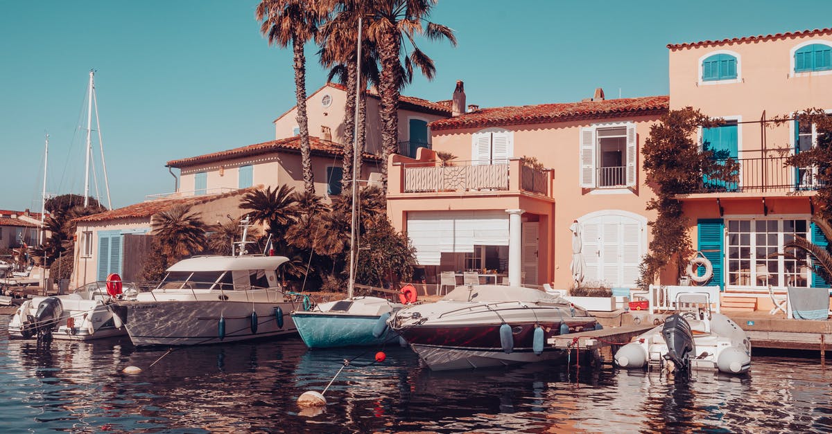 Hotel reservation cancelled after submitting my France visa application - Building With Boats Docked Next To It