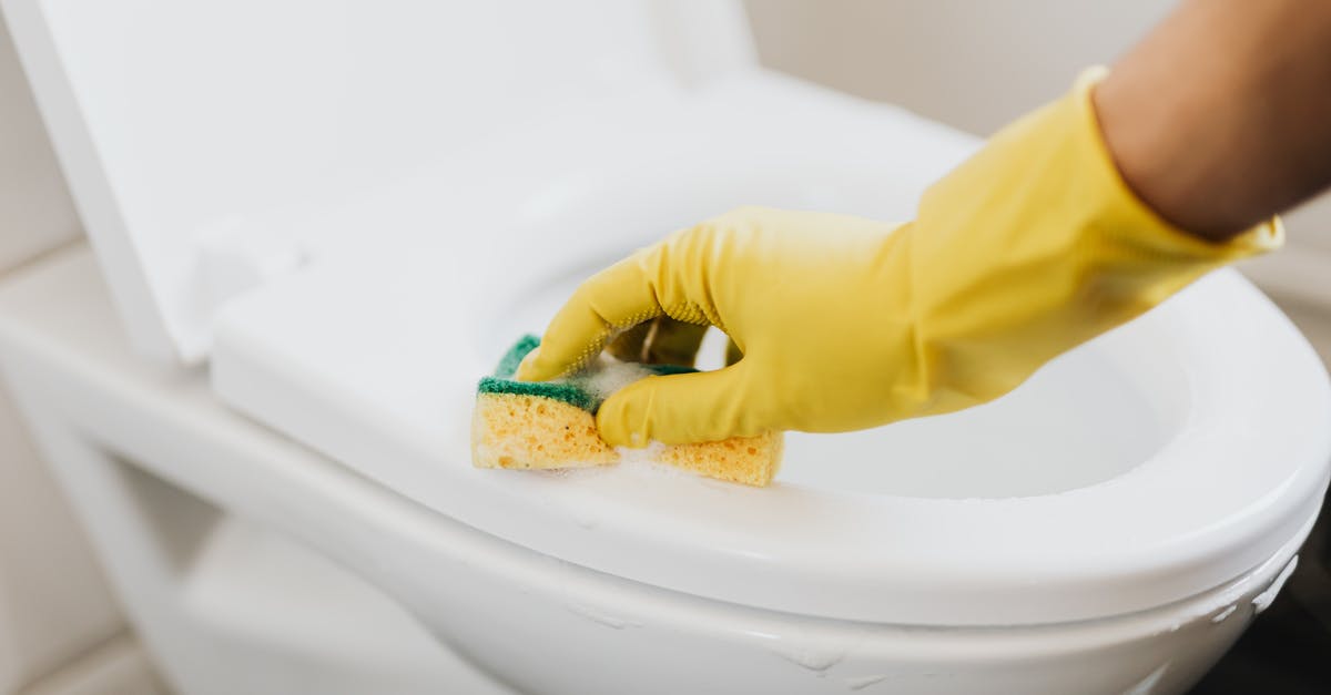 How am I supposed to keep a toilet bowl clean without a toilet brush? - From above of crop anonymous person in rubber gloves using soapy sponge while cleaning toilet bowl How am I supposed to keep a toilet bowl clean without a toilet brush? - From above of crop anonymous person in rubber gloves using soapy sponge while cleaning toilet bowl