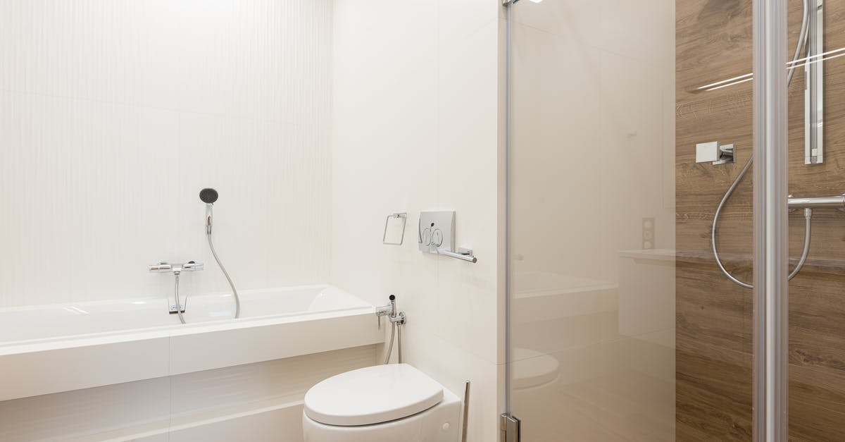 How am I supposed to keep a toilet bowl clean without a toilet brush? - Shower cabin with glass door and ceramic bathtub and toilet bowl in spacious light bathroom with wooden floor How am I supposed to keep a toilet bowl clean without a toilet brush? - Shower cabin with glass door and ceramic bathtub and toilet bowl in spacious light bathroom with wooden floor