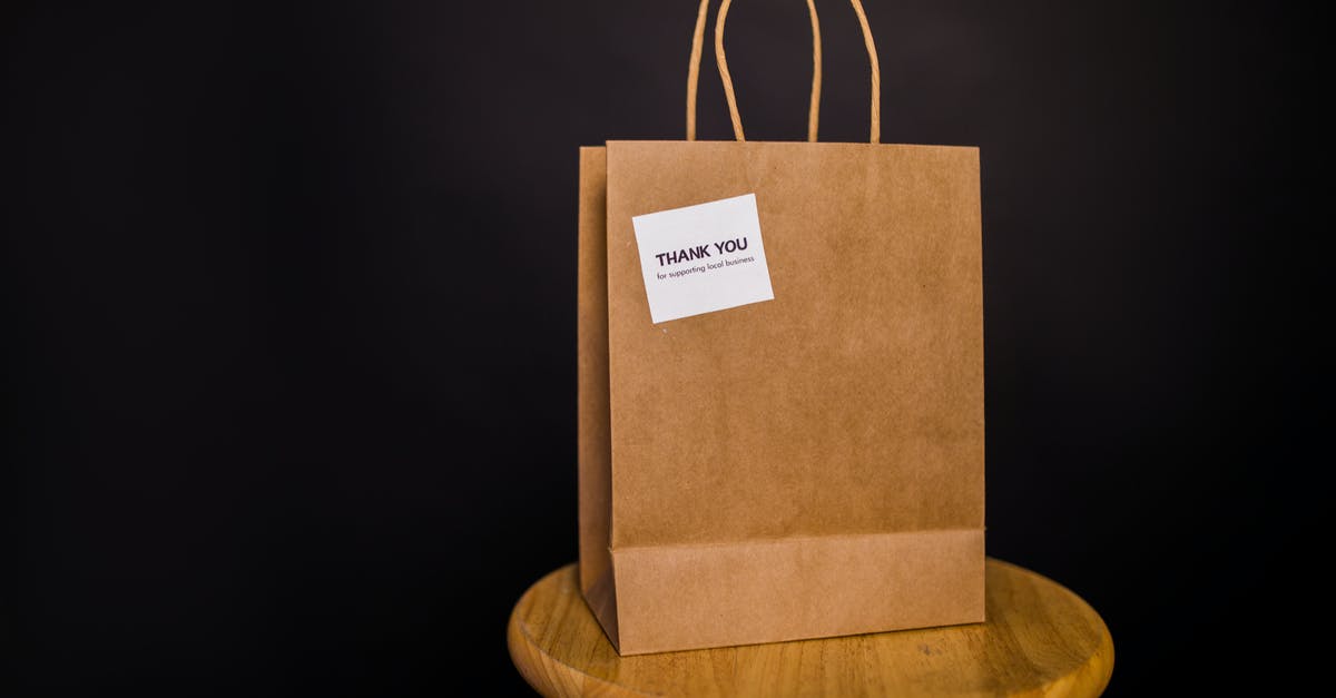 How are customs duties handled by the Fedex "Baggage Free" service? - Brown Paper Bag on Brown Wooden Stool