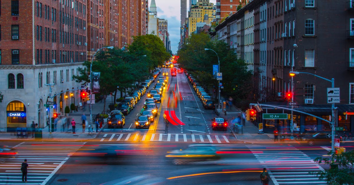 How are intersections between two numbered streets named in New York? - Timelapse Photography of Vehicles on Road