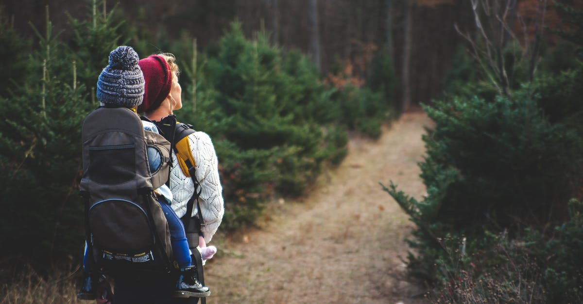 How are Scottish hiking trails marked? - Shallow Focus on Blond Haired Woman in White Long Sleeve Shirt Carrying a Baby on Her Back How are Scottish hiking trails marked? - Shallow Focus on Blond Haired Woman in White Long Sleeve Shirt Carrying a Baby on Her Back