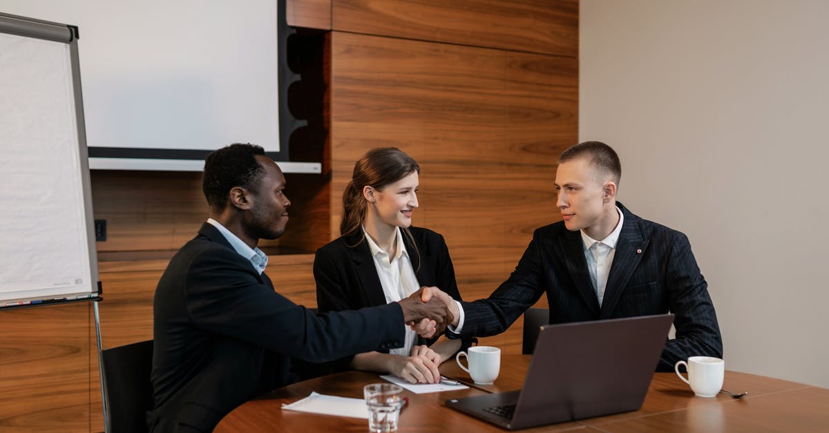How available is Internet in Sierra Leone? - Man in Black Suit Jacket Sitting Beside Man in Black Suit How available is Internet in Sierra Leone? - Man in Black Suit Jacket Sitting Beside Man in Black Suit