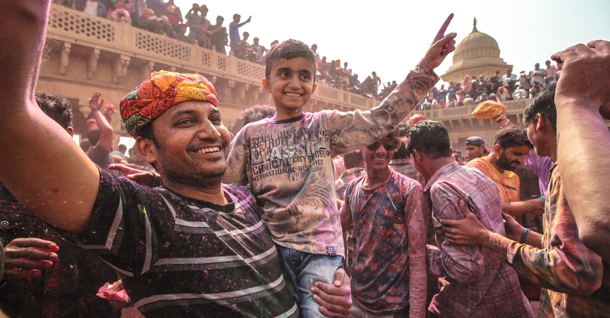 How big is the Holi festival in India? - Man In Black And White Striped Shirt How big is the Holi festival in India? - Man In Black And White Striped Shirt