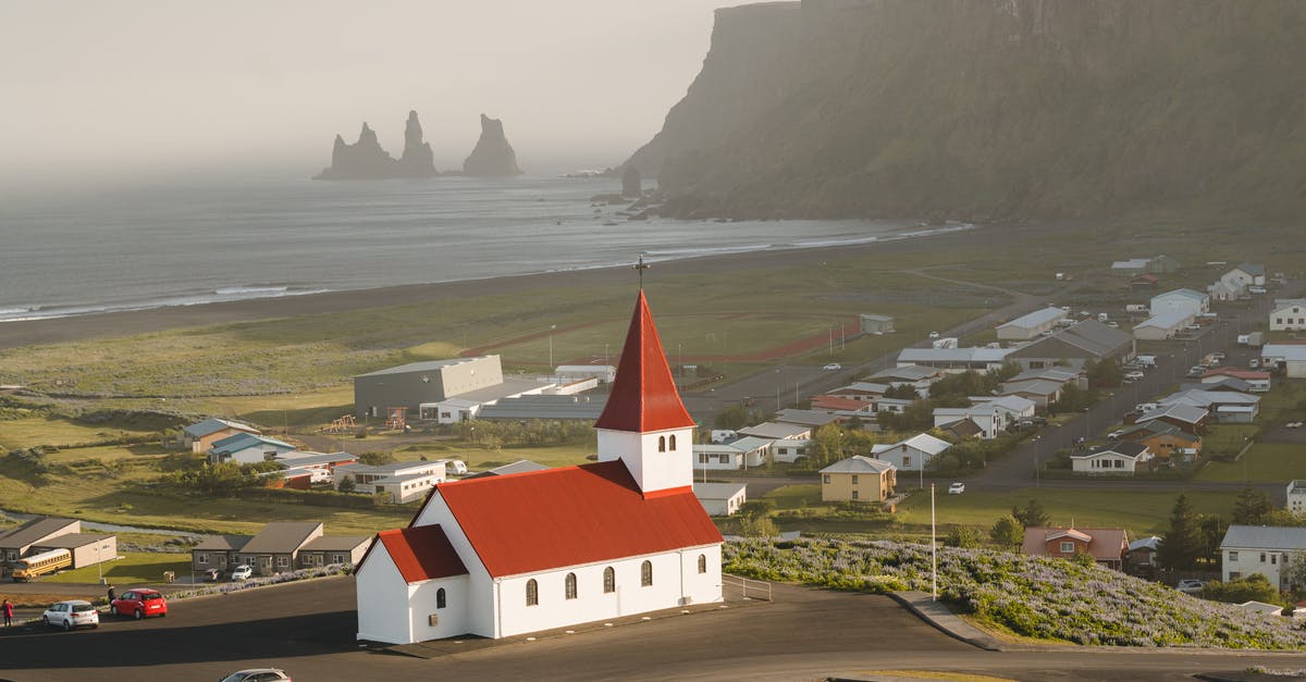 How busy are the Faroe Islands during summer compared to Iceland? - White and Red House Near Road How busy are the Faroe Islands during summer compared to Iceland? - White and Red House Near Road
