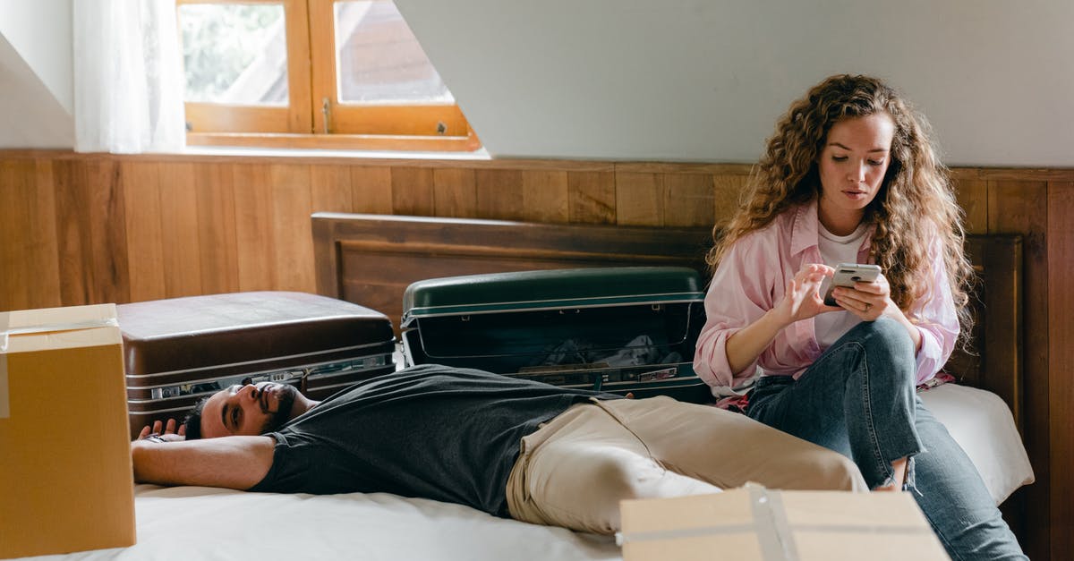 How can 4 suitcases be collected between 9 AM - 12 noon in England to be moved, without using 'man with a van'? [closed] - Calm diverse couple during relocation in new apartment