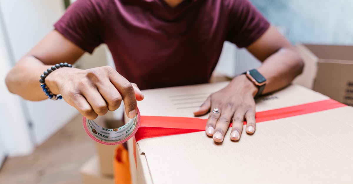 How can 4 suitcases be collected between 9 AM - 12 noon in England to be moved, without using 'man with a van'? [closed] - Man in Purple Crew Neck T-shirt Wearing Silver Ring