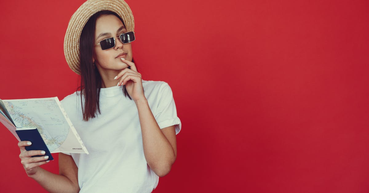 How can I check if tour services are reliable? - Thoughtful young woman in retro hat and trendy sunglasses holding map and touching chin while looking pensively away on red background How can I check if tour services are reliable? - Thoughtful young woman in retro hat and trendy sunglasses holding map and touching chin while looking pensively away on red background