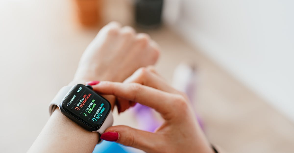 How can I check the status of an Australian visa application? - Faceless woman checking smartwatch and sitting on mat How can I check the status of an Australian visa application? - Faceless woman checking smartwatch and sitting on mat